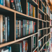 books on brown wooden shelves